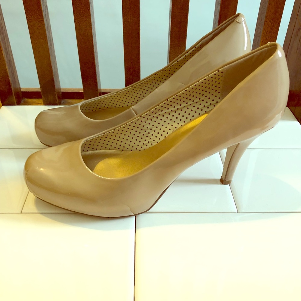 Nude Madden Girl rounded toe platform pumps.